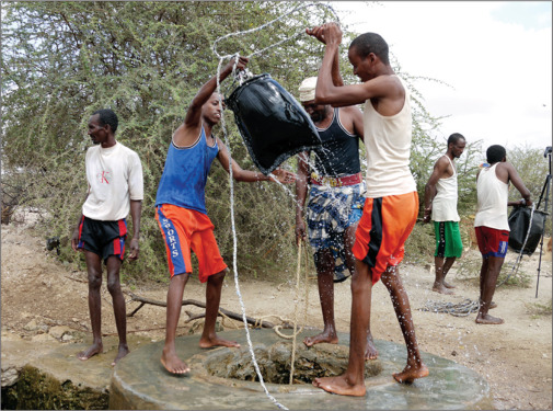 Men haul water from a well in Wajir, Kenya